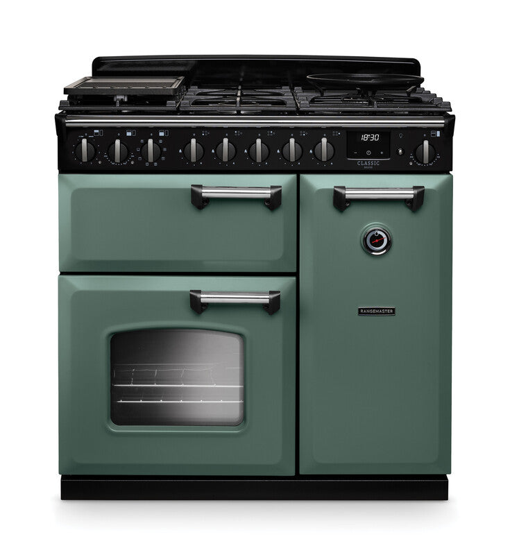 Rangemaster Classic Deluxe 90cm chrome dual fuel rangecooker in green with multiple ovens and control knobs