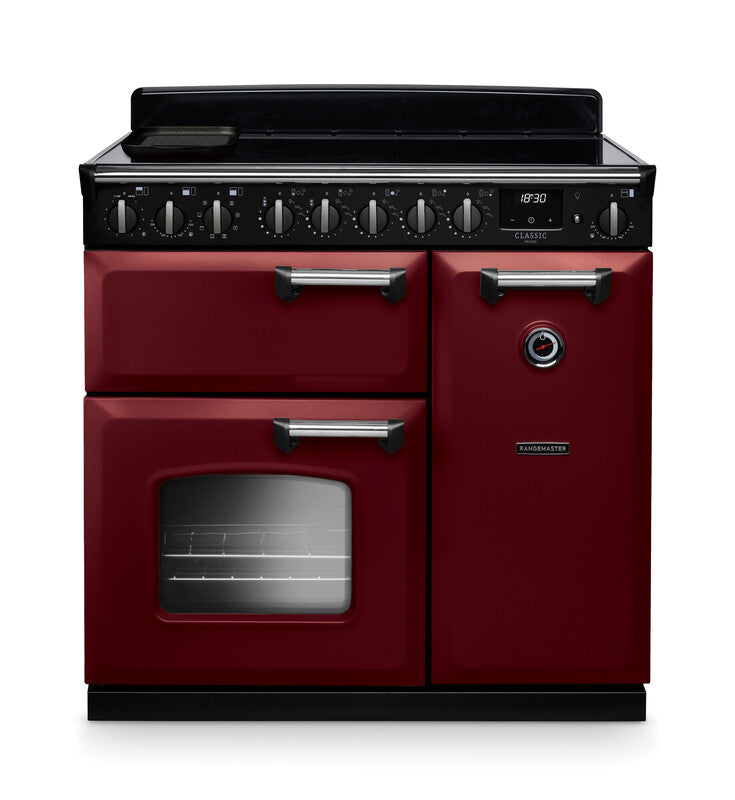 Rangemaster Classic Deluxe 90cm induction rangecooker in red with chrome handles and black control panel