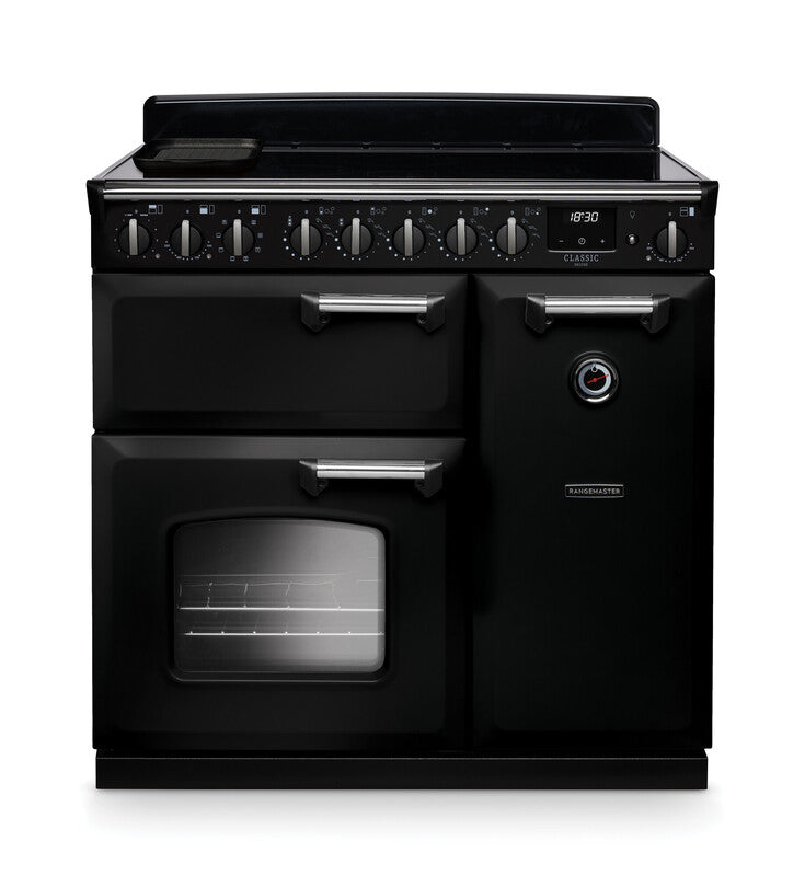 Rangemaster Classic Deluxe 90cm black induction rangecooker with multiple control knobs and oven window