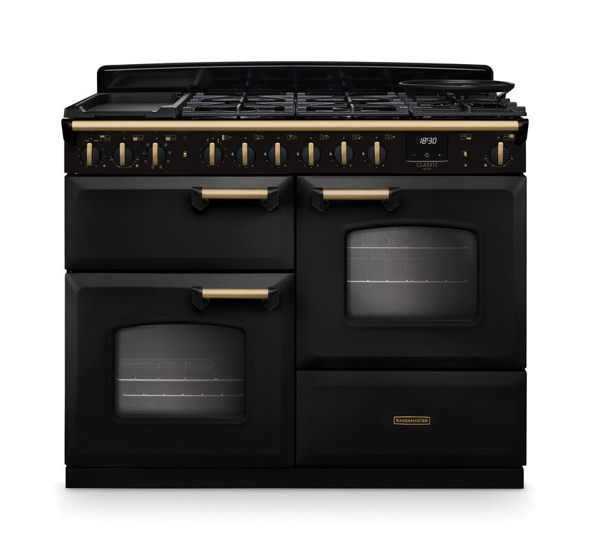 Rangemaster Classic Deluxe 110 dual fuel cooker in black with antique brass handles and trim, front view.