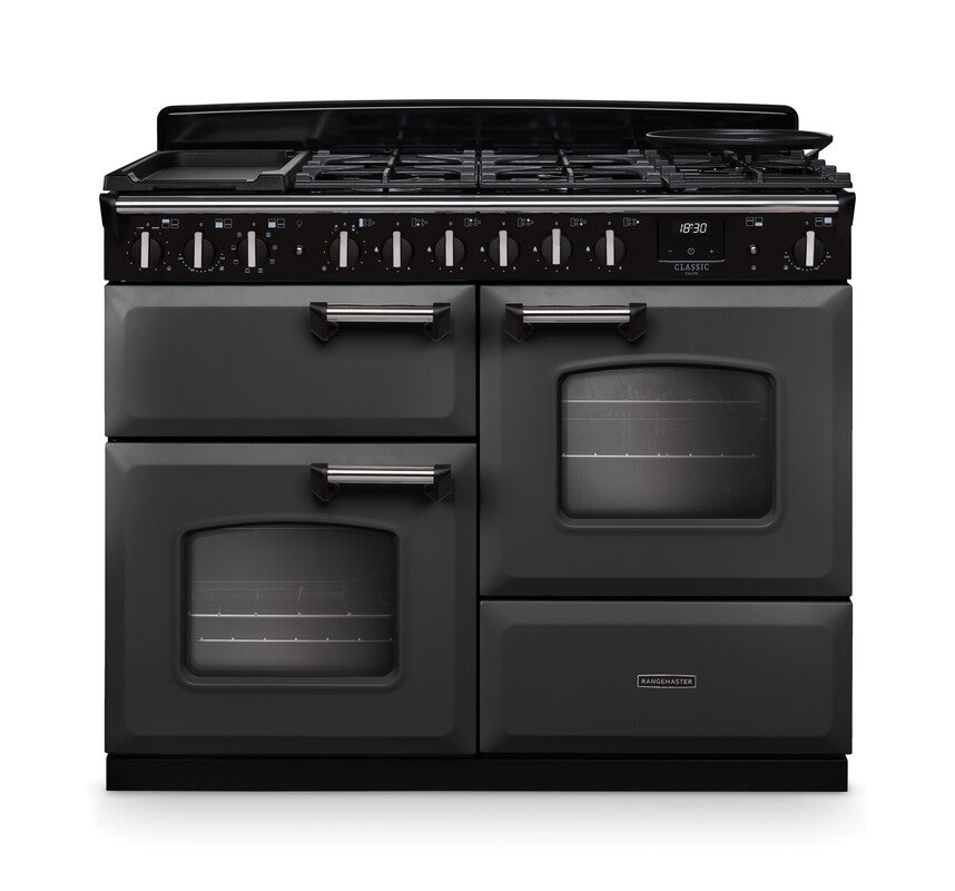 Rangemaster Classic Deluxe 110 dual fuel cooker in black with chrome trim, showing front view with ovens and control knobs
