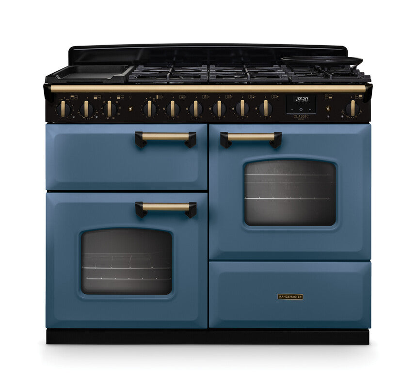Rangemaster Classic Deluxe 110 dual fuel cooker in blue with antique brass handles and trim, front view.