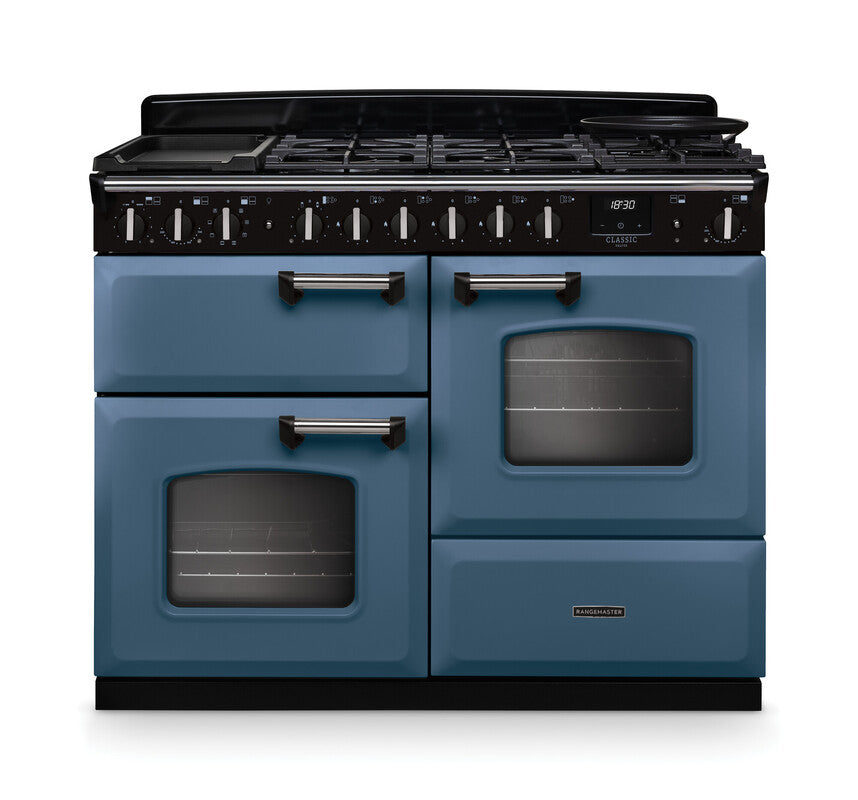 Rangemaster Classic Deluxe 110 dual fuel cooker in blue with chrome handles and black control panel with knobs and digital