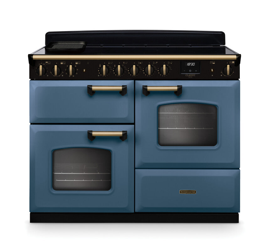 Rangemaster Classic Deluxe 110 induction cooker in blue with antique brass handles and trim, front view.