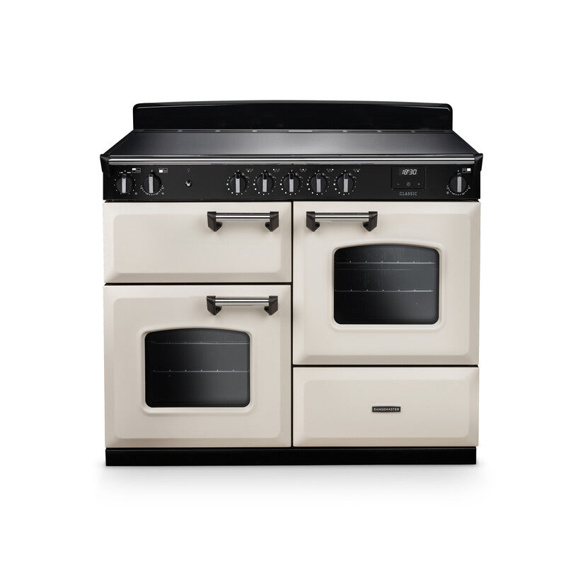 Rangemaster Classic 110cm cream and black induction rangecooker with two ovens and control knobs