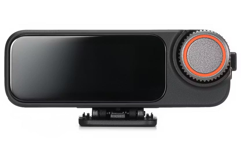 Dji Mic 3 Receiver front view showing black rectangular body with a large circular control knob on the right side.