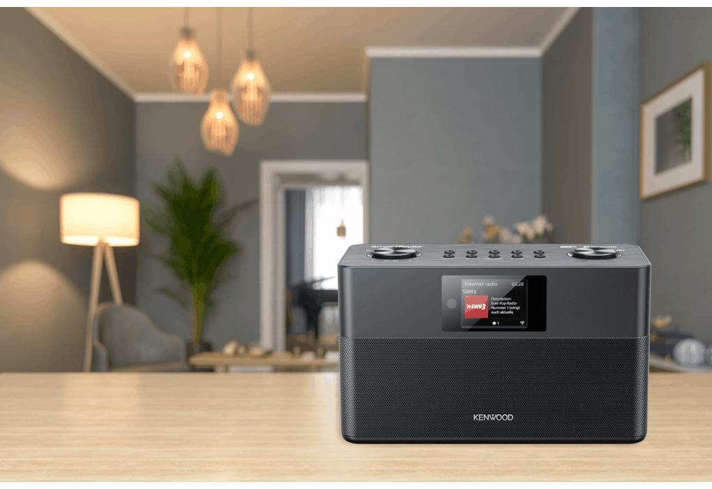 Kenwood Black Wifi FM Dab Radio on a wooden table in a modern living room setting