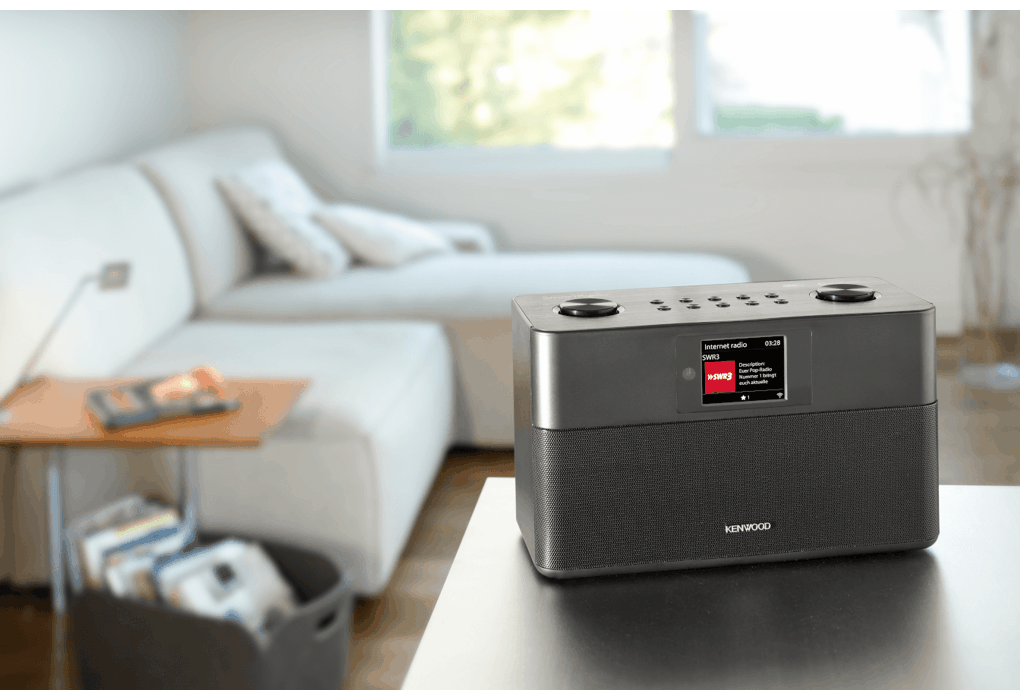 Kenwood Black Wifi FM Dab Radio on a table with a blurred living room background