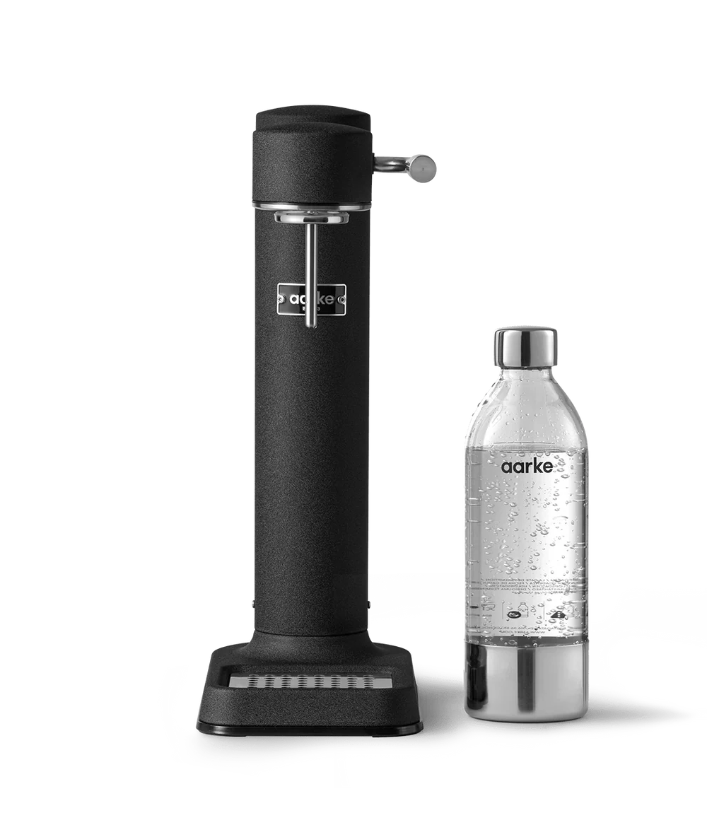 Aarke Carbonator 3 Matte Black sparkling water maker with matching carbonated water bottle on white background