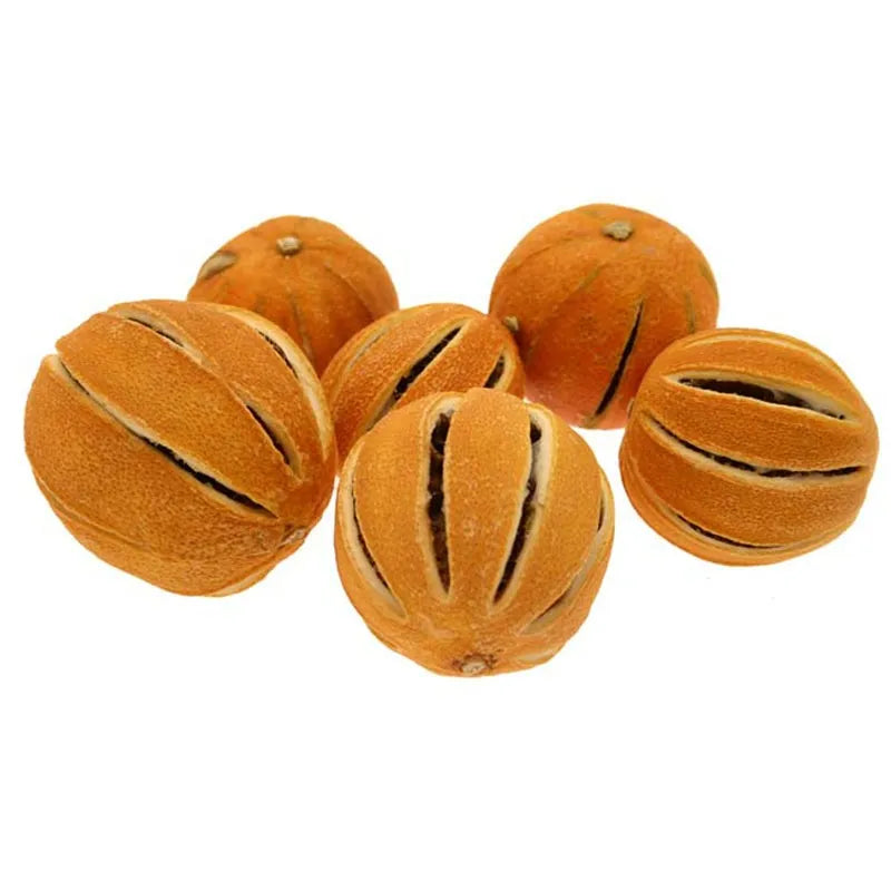 Six dried whole oranges with natural splits, showing a warm orange-brown rustic texture on white background.