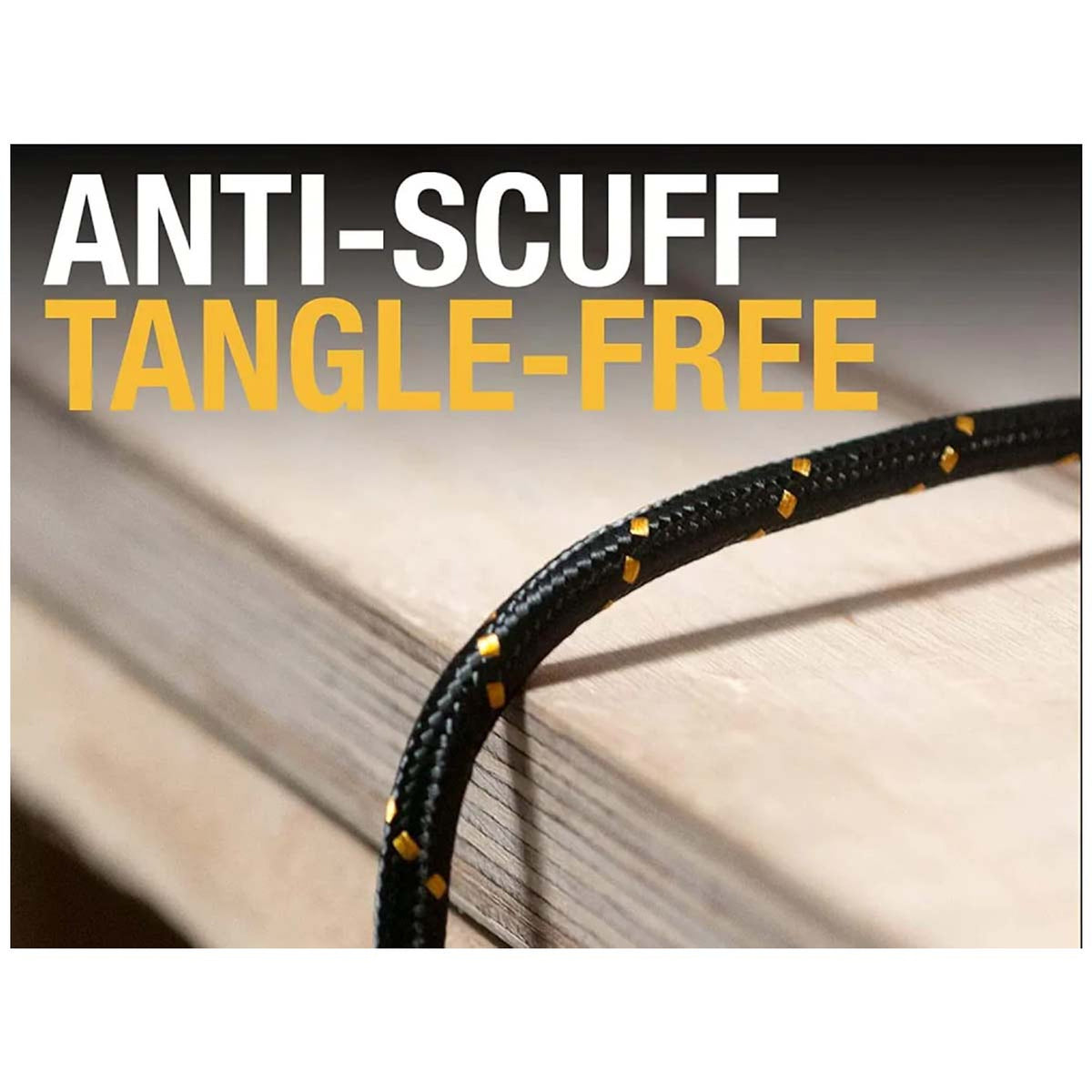 Close-up of DeWalt reinforced USB C to USB C charging cable with black and yellow braided exterior on wood surface.