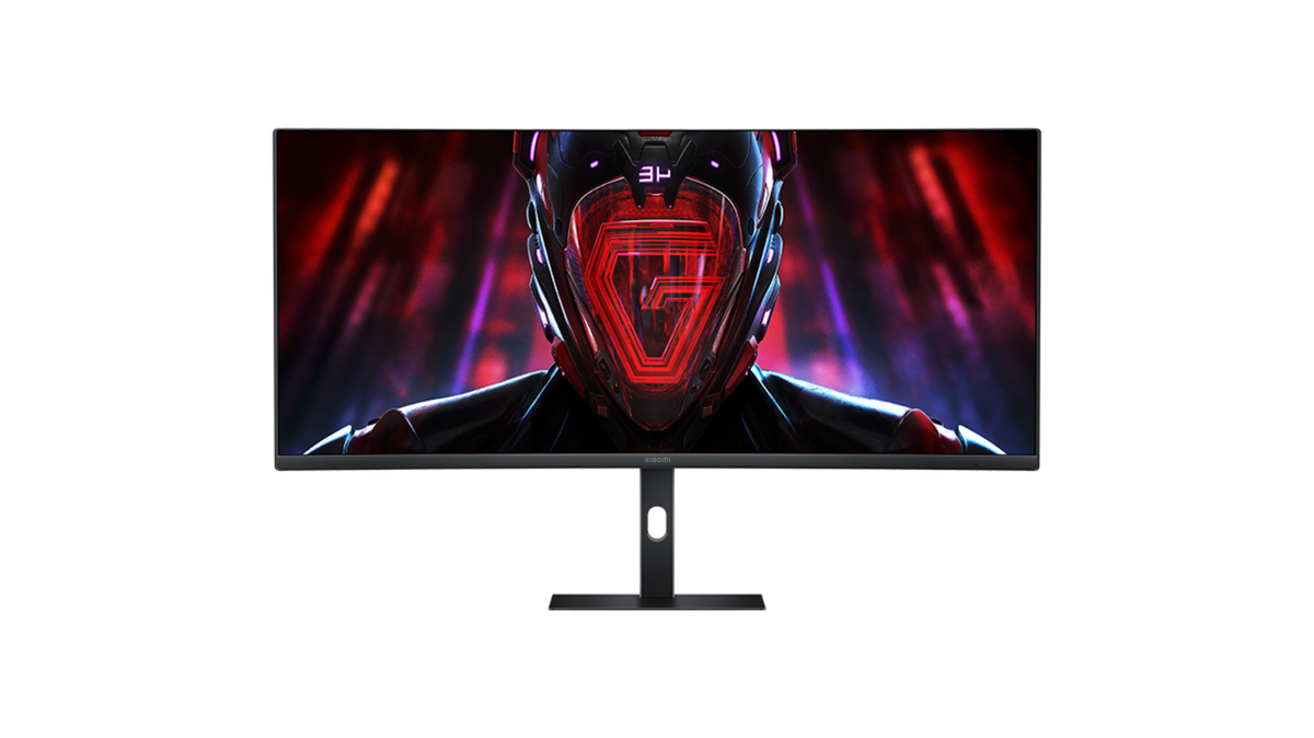 Xiaomi G34i 34" curved gaming monitor with thin bezels, black stand, and sci-fi helmet graphic on screen.