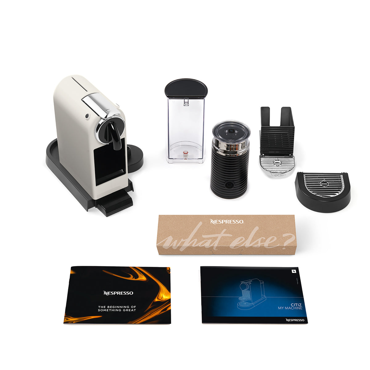 Delonghi Citiz Nespresso coffee machine in white with Aeroccino milk frother and accessories on white background