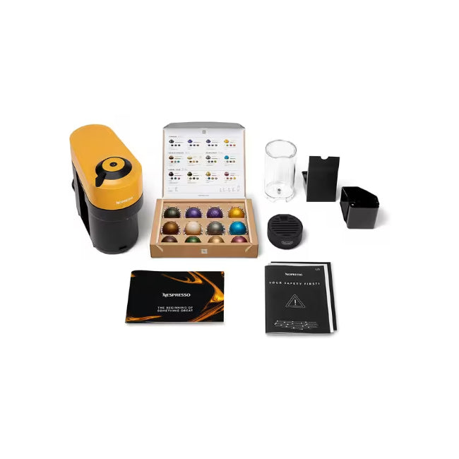 Collection of coffee-related items including a yellow and black device, a box of coffee pods, and packaging on a white background.