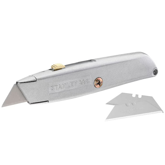 Stanley 99E retractable blade knife with metal body and two spare utility blades beside it.