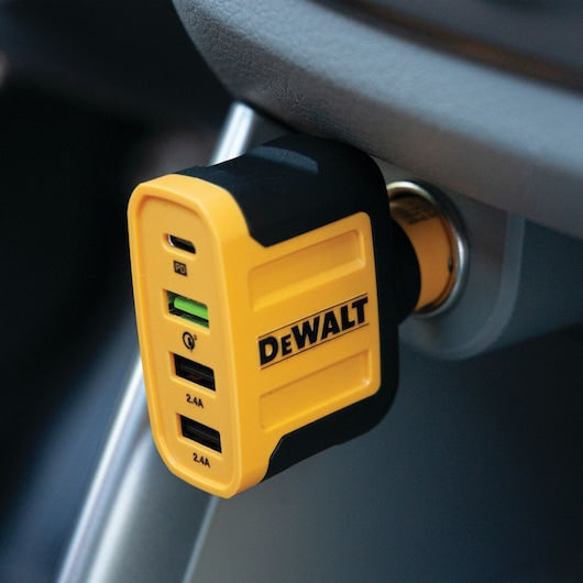 DeWalt 4-port 60W USB PD car charger plugged into a vehicle power outlet with visible USB ports and logo.