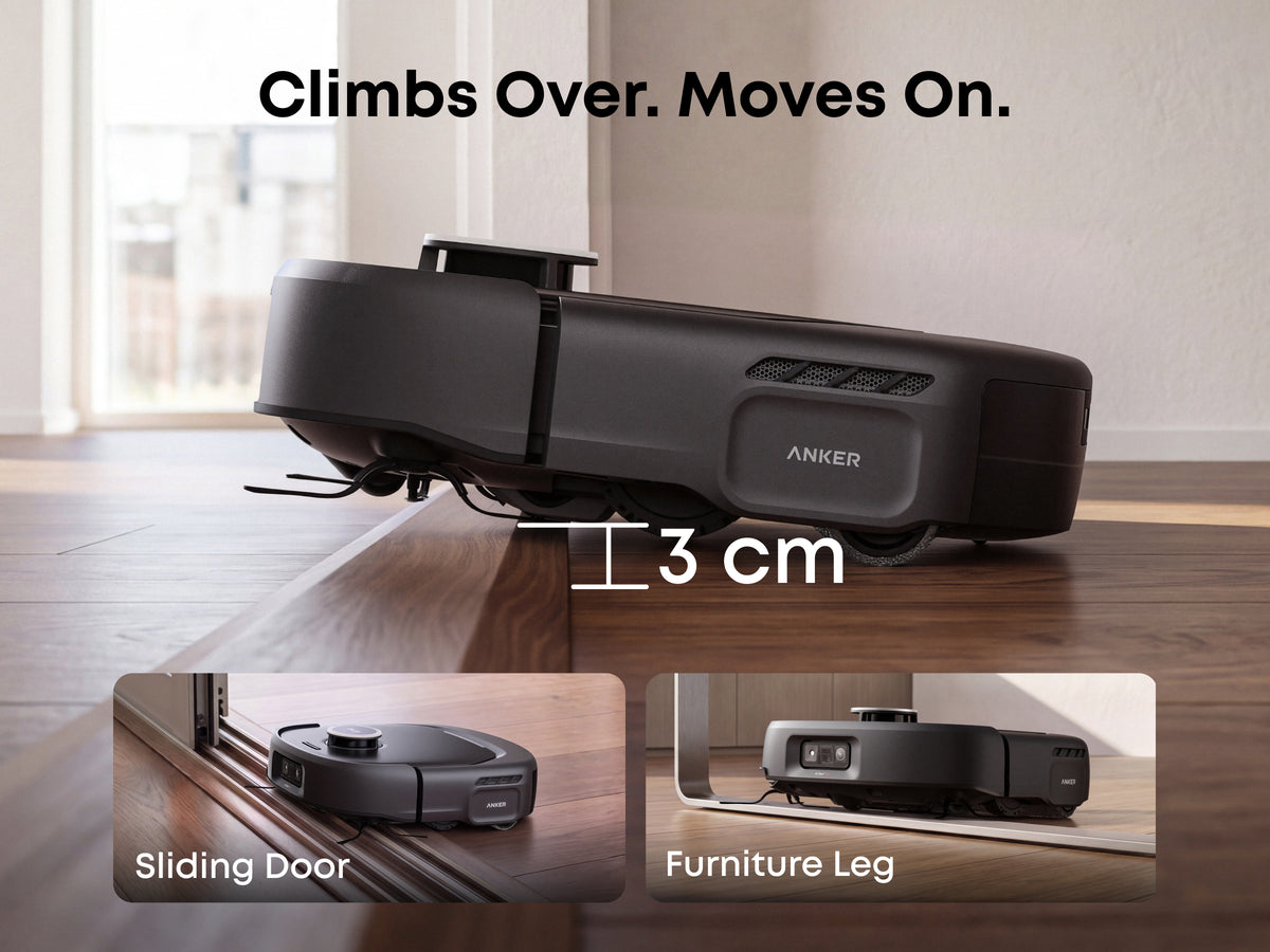 Eufy E35 Omni Robot Vacuum Cleaner climbing a 3 cm wooden threshold on a hardwood floor.