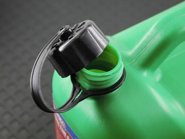 Close-up of the open black cap on a green 5 litre plastic fuel canister.