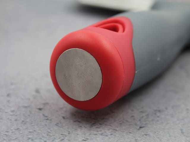 Close-up of the red and gray handle end of the Faithfull Drywall Taping Knife with a metal hanging hole cover.