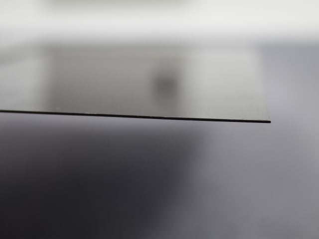 Close-up side view of the thin blue steel blade of the Faithfull Drywall Taping Knife 200mm