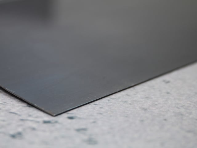 Close-up of the blue steel blade edge of the Faithfull Drywall Taping Knife 200mm.