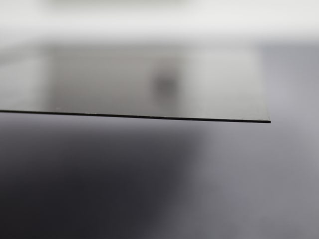 Close-up side view of the thin blue steel blade of the Faithfull Drywall Taping Knife 300mm