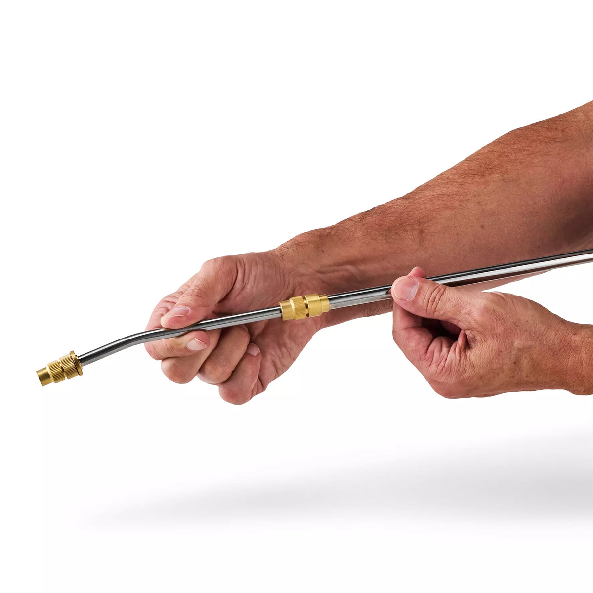Hands holding and adjusting the metal spray lance with brass fittings for Einhell 18V pressure sprayer
