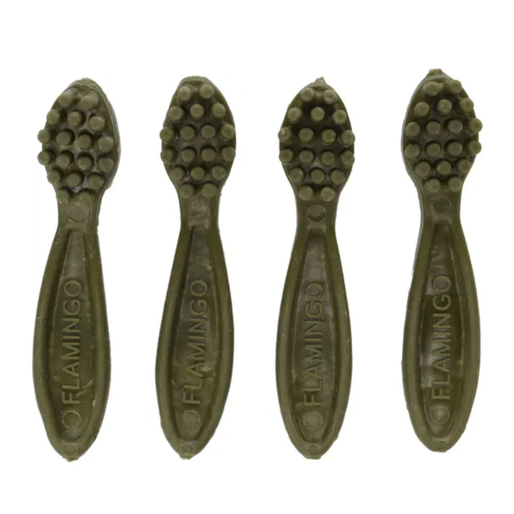 Four green apple-flavored toothbrush sticks for dogs with textured cleaning surfaces and FLAMINGO branding.