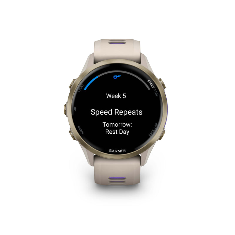 Garmin Forerunner 970 in French Grey with Indigo accents showing a training screen for Week 5 Speed Repeats.