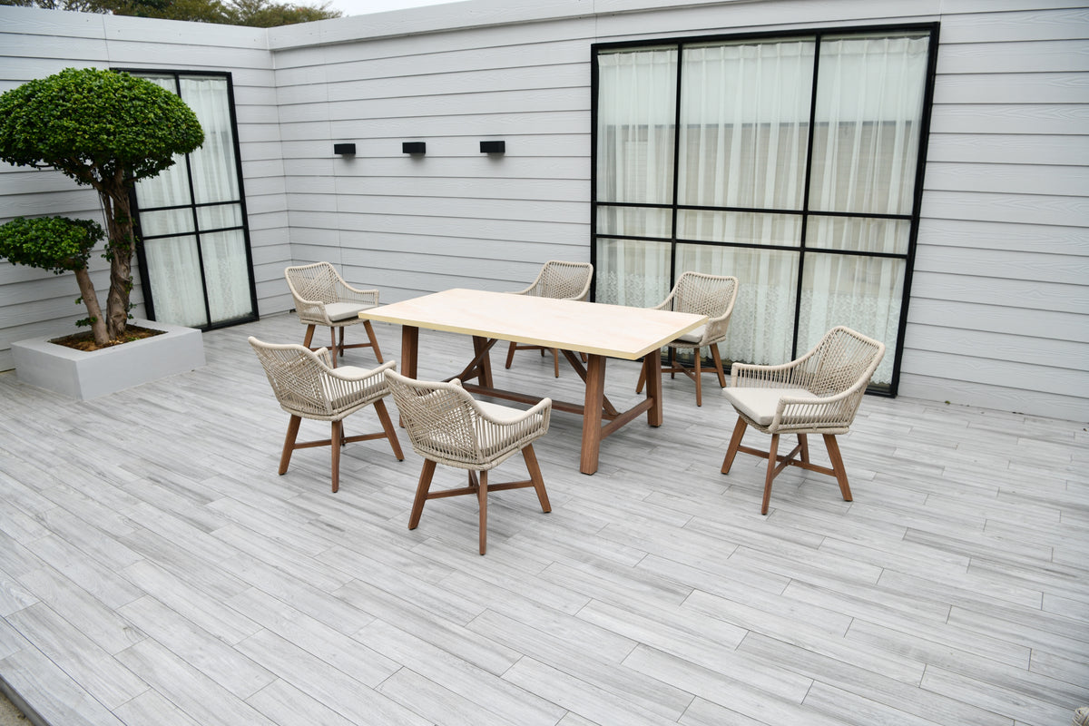 Genoa 6 seater garden dining set with wood effect table and cream oatmeal woven chairs on patio