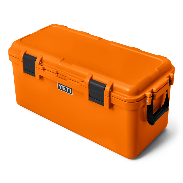 Yeti Loadout Gobox 60 gear case in bright orange with black latches and side handle, front view angled right.