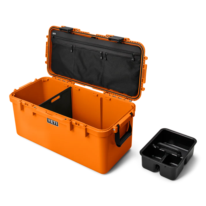 Open bright orange Yeti Loadout Gobox 60 Gear Case King Crab with black interior divider and separate black tray accessory.