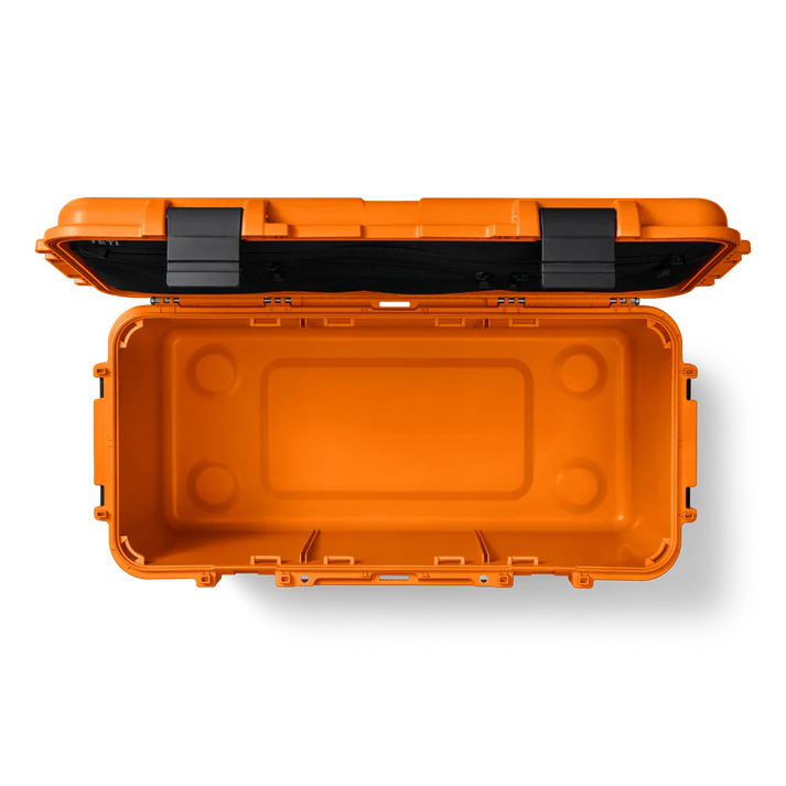 Open bright orange Yeti Loadout Gobox 60 gear case showing empty interior and black latches on lid.