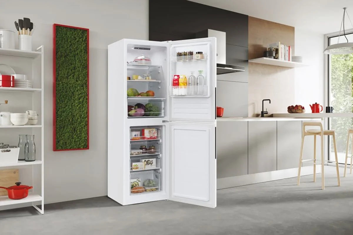 Hoover 50/50 black low frost fridge freezer with open doors showing stocked interior in modern kitchen.