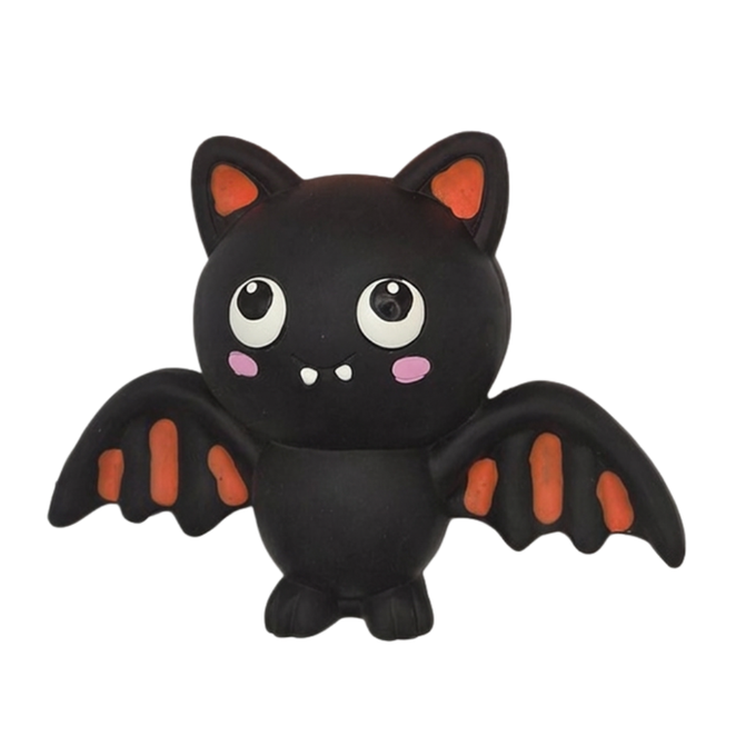 A cute black rubber vampire bat toy with orange-tipped wings and ears, large white cartoon eyes, and pink cheeks, isolated on a white background.