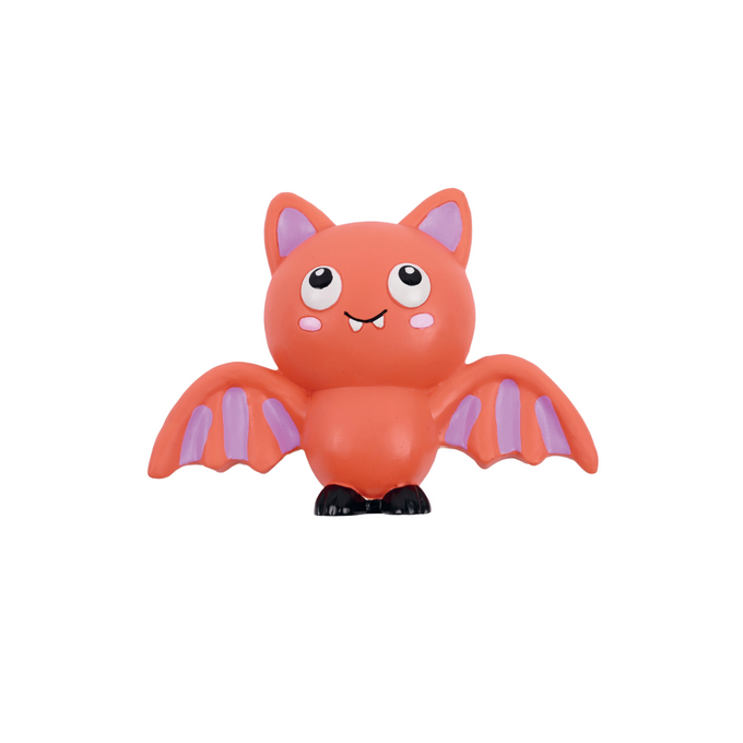 A cute cartoon bat toy or figurine in bright orange-red with light purple wings and inner ears, large white eyes, and small black feet, centered on a plain white background.