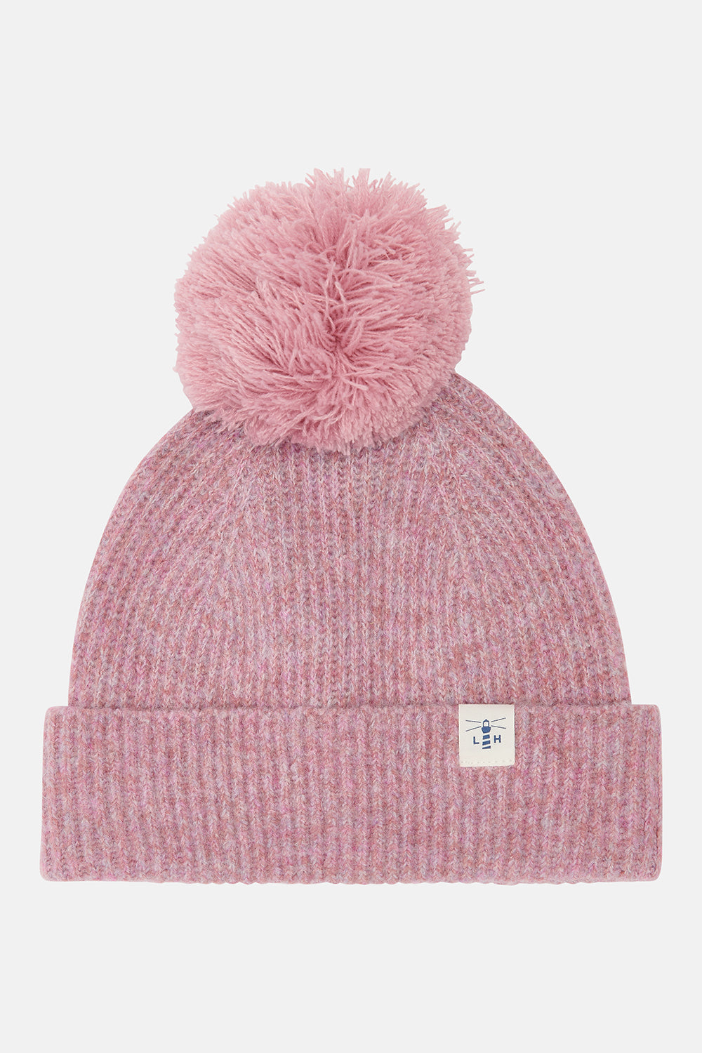 Pink cable knit Hannah Hat with large pompom and folded cuff featuring a small lighthouse logo patch.