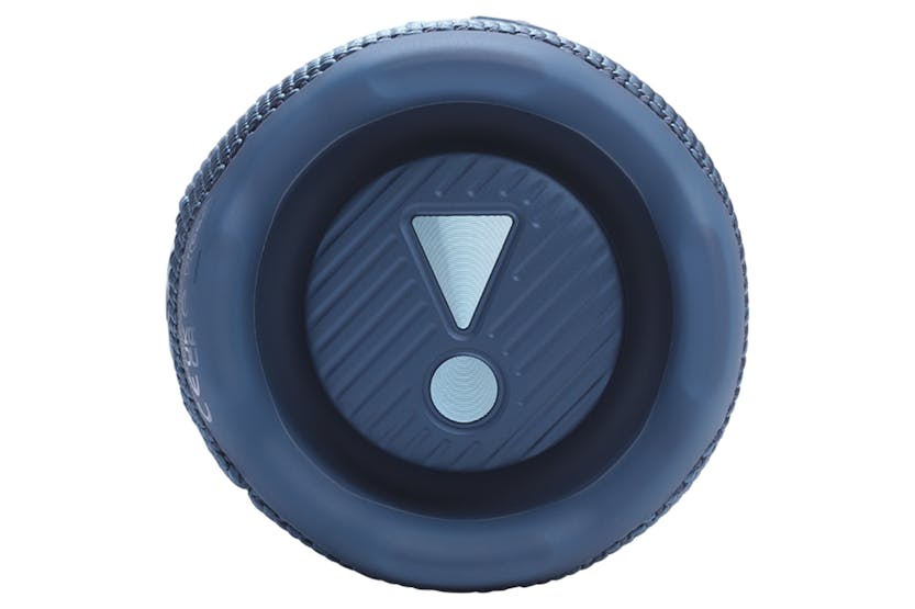 Close-up of the blue JBL Flip 7 portable Bluetooth speaker's circular end with an exclamation mark design.