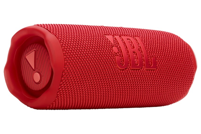 Red JBL Flip 7 portable Bluetooth speaker angled to show textured fabric and side passive radiator detail.