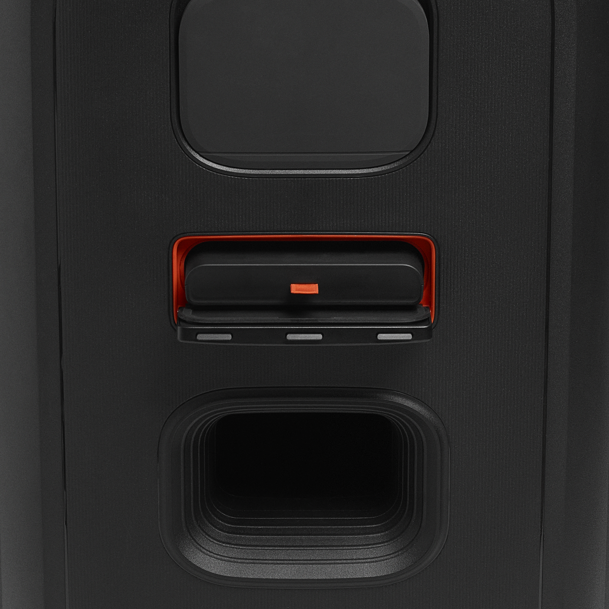 Close-up of the JBL Partybox 520 battery compartment with black and orange details.
