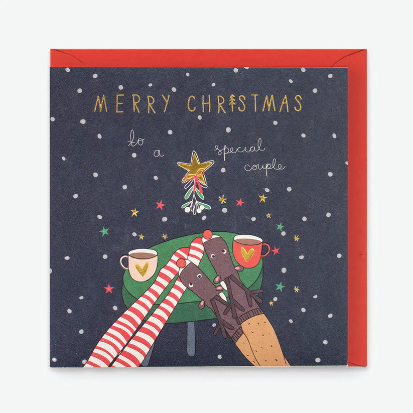 Christmas card with gold foiled "Merry Christmas to a special couple" and festive reindeer and striped legs illustration.