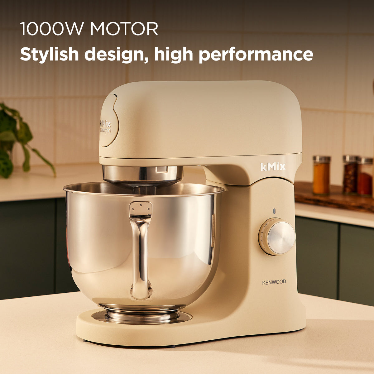 Cream Kenwood kMix stand mixer with stainless steel bowl on kitchen counter