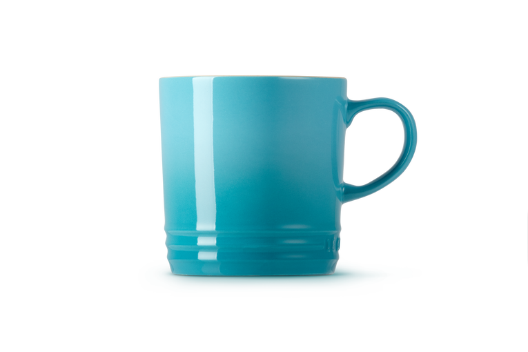 Le Creuset teal stoneware mug, durable and stylish, available at Keans Claremorris.