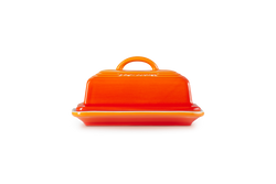 Le Creuset Butter Dish Volcanic, durable stoneware with vibrant orange glaze, available at Keans Claremorris.