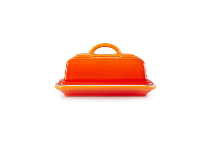 Le Creuset Butter Dish Volcanic, durable stoneware with vibrant orange glaze, available at Keans Claremorris.