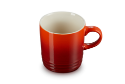 Le Creuset Stoneware Mug in Cerise red, durable and vibrant, available at Keans Claremorris.