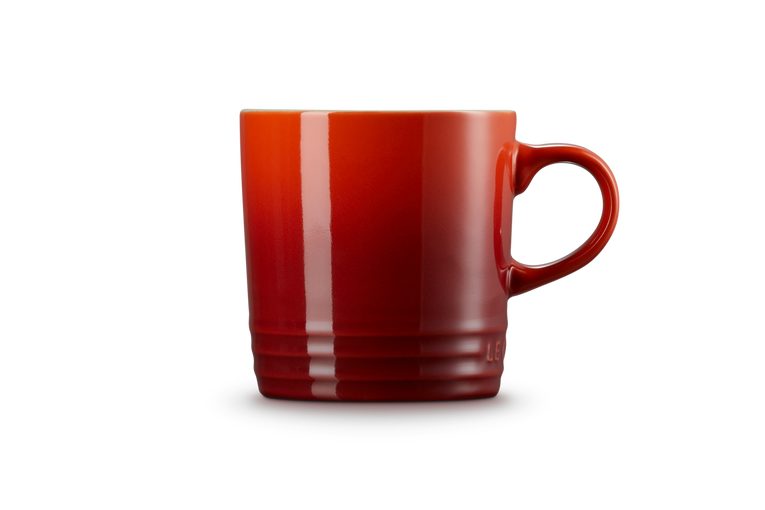 Le Creuset Stoneware Mug in Cerise red, durable and vibrant, available at Keans Claremorris.