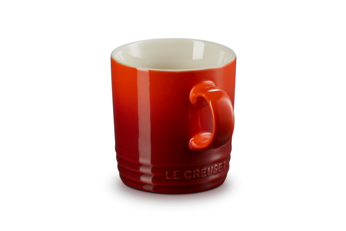Le Creuset Stoneware Mug in Cerise red, durable and vibrant, available at Keans Claremorris.