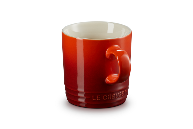 Le Creuset Stoneware Mug in Cerise red, durable and vibrant, available at Keans Claremorris.