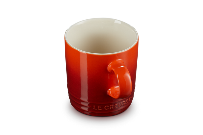 Le Creuset Stoneware Mug in Cerise red, durable and vibrant, available at Keans Claremorris.